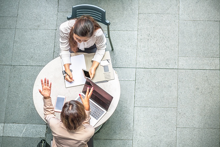 Two people at meeting — AEO Certification